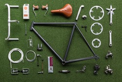 Vintage Bicycle Frame And Parts Laid Out On A Green Mat Ready For Assembly