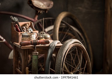 Vintage bicycle repair workshop with spare parts. Repair shop In an old wooden shed. - Powered by Shutterstock