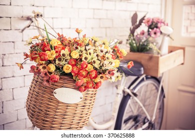 vintage bicycle with welcome sign on vintage white brick wall,warm and pastel,split toned. - Powered by Shutterstock