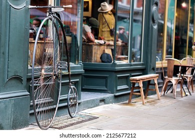 Vintage Bike Next To A Clothing Shop