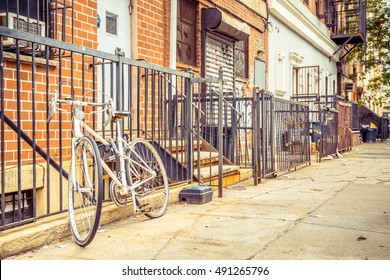 vintage bike standing at wall in williamsburg, brooklyn