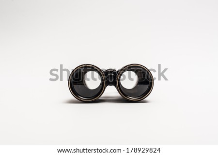Vintage binoculars on a white background