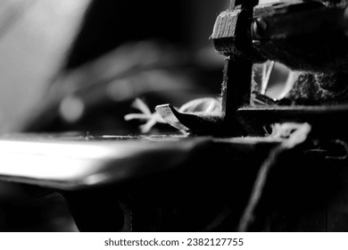 Vintage Black and White Close up Serger or Overlock Machine with threads, vintage black and white concept - Powered by Shutterstock