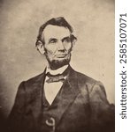 A vintage black and white portrait of a man in a suit with a bow tie, featuring a distinctive beard and thoughtful expression. Vintage art.