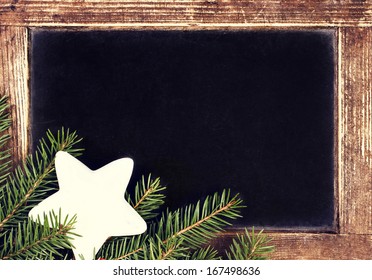 Vintage Blackboard With Vintage Wooden Frame.   Old Fashioned Slate Chalk Board With Christmas Ornaments, Tree Branch And Copy Space For Greeting Text.