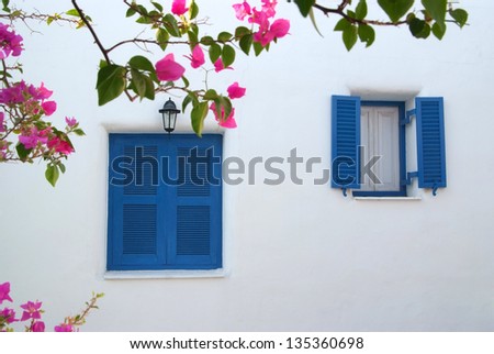 Vintage blue window on the white wall