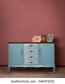 Vintage Blue Wooden Dresser, Tender Bouquet And Two Frames. Blue And Brown Vintage Interior. Brown Room With Ethnic Dresser. Antique Cupboard. Clothes Closet. Vanity Table