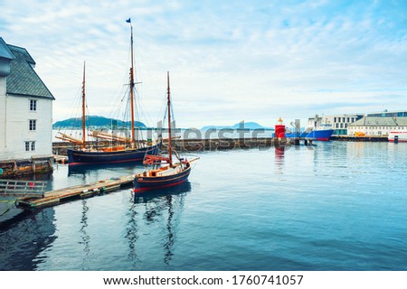 Vintage boats in the port of Alesund, Norway. Summer landscape. Famous travel destination