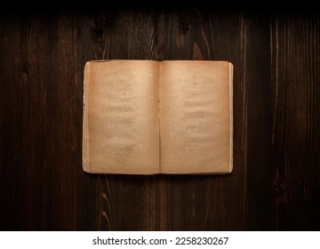 Vintage book, open, on old wooden table, with clipping path. Open Book blank on old wooden background. book with blank pages - Shutterstock ID 2258230267