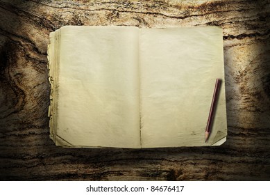 Vintage book with pencil on wood - Powered by Shutterstock