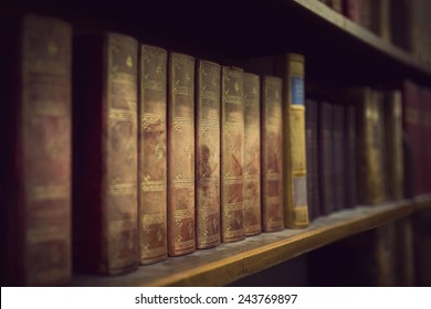 Vintage Books In Book Case In Library