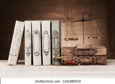 Vintage books, scales and magnifier. Concept law and justice
