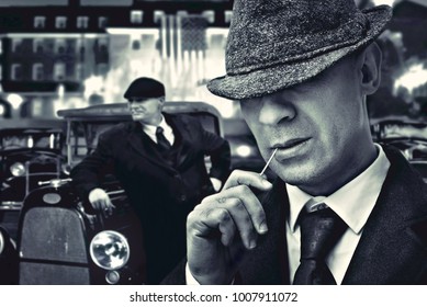 vintage bossy Italian mafia gangsters in 1930's near classic car