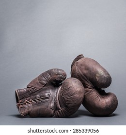 Vintage Boxing Gloves On A Gray Background