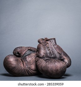 Vintage Boxing Gloves On A Gray Background