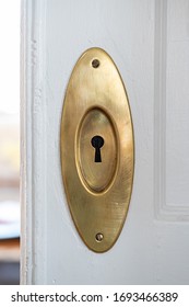 Vintage Brass Lock To A Freshly Painted White Pocket Door