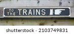 Vintage British To The Trains Sign at a railway station