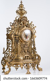 vintage bronze watch, bronze fireplace clock, golden old desktop clock, vintage bronze clock side photo, antique clock studio photo, old bronze ticker in gilding