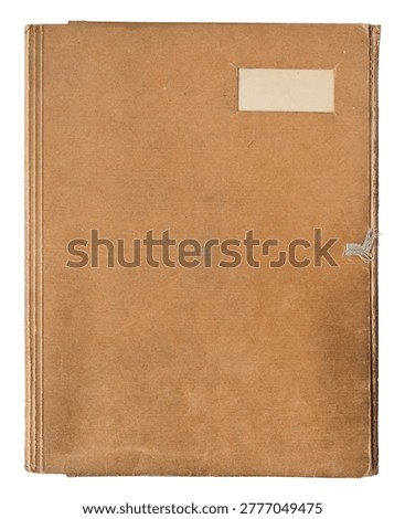 Vintage brown closed paper  folder with blank label, top view isolated