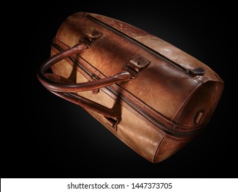 Vintage Brown Leather Duffle Bag Isolated On Black Background