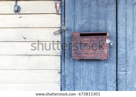 Vintage brown wood mailbox.