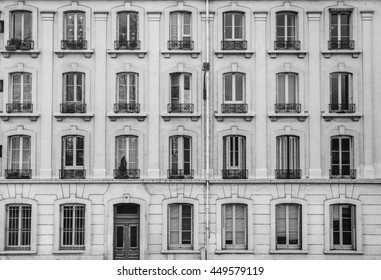 Vintage building facade wall. Rounded windows. Classic european architecture. Postcard concept. Travel inspiration. Luxury estate background. 