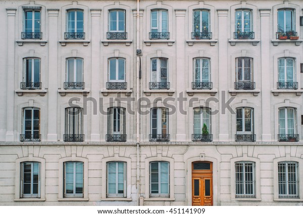 Vintage building facade wall.\
Rounded windows. Classic european architecture. Postcard concept.\
Travel inspiration. Luxury estate background. Film effect.\
