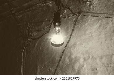 A Vintage Bulb Against A Muddy Wall