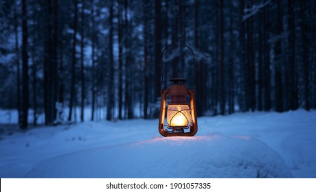 Vintage Burning Lantern On Snow. Dark Forest On Background. Night Forest. Winter Season. Copy Space.