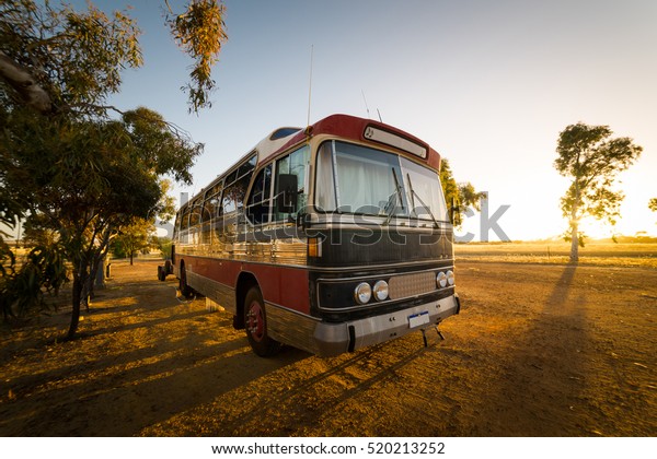 Vintage bus on a Hyden farm ,Western\
Australia.\
with sunrise in the\
morning.