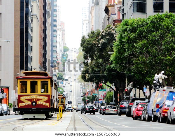 Vintage\
cable car stop in the street in San Francisco in California, the\
United States of America. Cable car is public transportation and\
tourism attraction in San Francisco city.\
2011-10