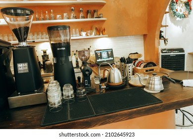 The Vintage Cafe Bar Restaurant Indoor. Empty Coffee Shop Interior Daytime With A Rustic Counter Orange Wall In The Background. Vietnam December 2021