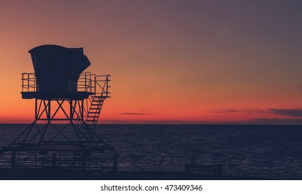 Vintage California sunset with life guard station silhouette