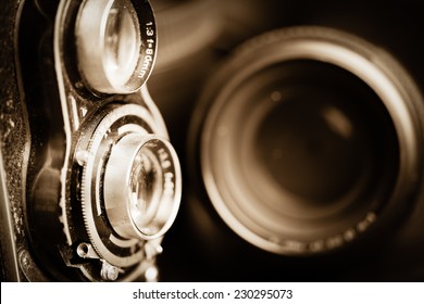 Vintage camera and lenses toned in sepia - Powered by Shutterstock