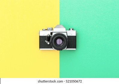 Vintage Camera On Color Background. Retro Style Toned Picture. Minimalistic Concept