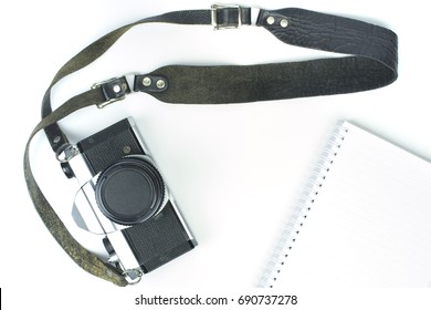 Vintage Camera With Strap And Book On White Background, Top View