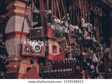 vintage cameras at flea market. Collection of retro-film analog cameras. many kinds of different model old photo cameras in a street store.