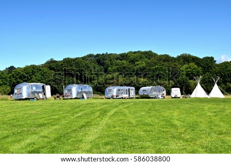 Vintage campsite with airstream trailers and teepees
