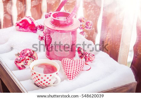 Vintage Candle Lamp, Heart, Hot Cup of Tea on the Snow, Pomegranate, Daylight, Outdoors. Copy space, Selective focus, Toned. 