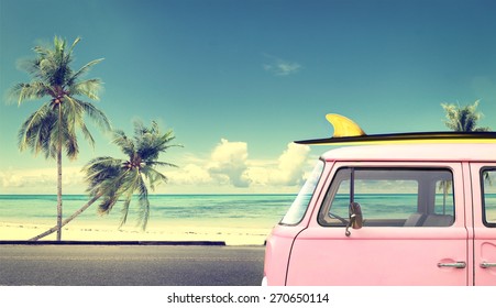 Vintage car in the beach with a surfboard on the roof - Shutterstock ID 270650114