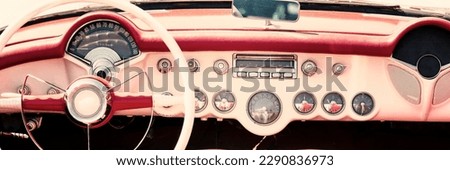Vintage car dashboard and steering wheel. Retro car vintage style.