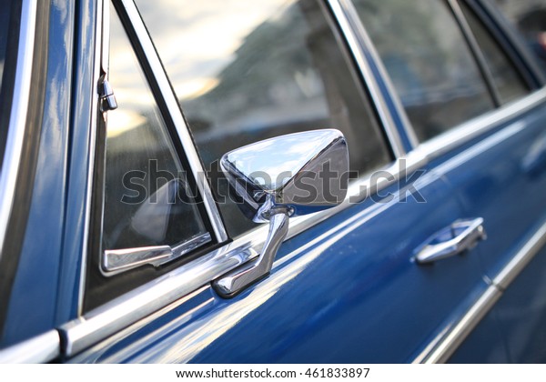 Vintage car detaill.\
Window and rear mirror.