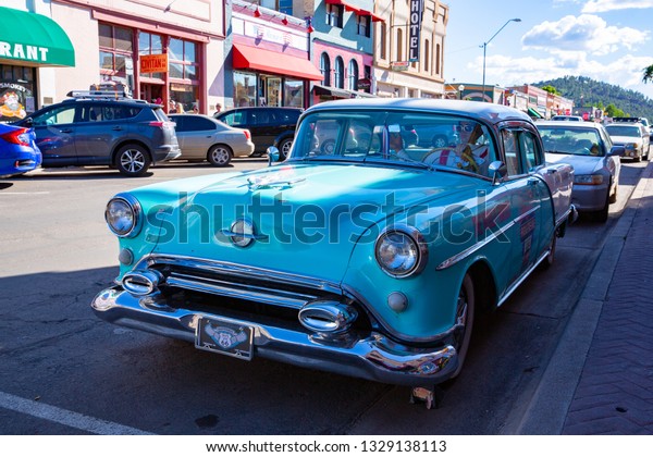 Vintage car in downtown Williams, Route 66 in\
Arizona, USA,\
07-22-2018