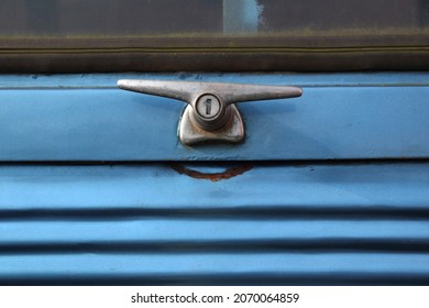 Vintage Car Handle And Blue Background.