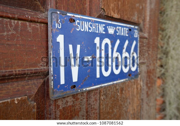 vintage car license plate on\
wall