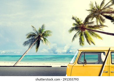 Vintage Car On The Beach With A Surfboard 