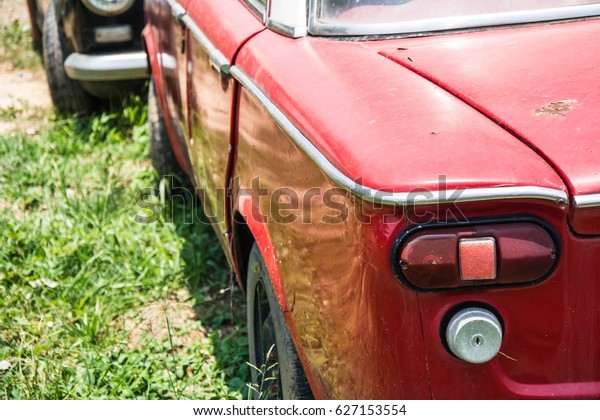 vintage car on a car\
graveyard