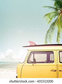 Vintage Car Parked On The Tropical Beach (seaside) With A Surfboard On The Roof