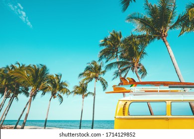 vintage car parked at the tropical beach (seaside) with a surfboard on the roof - Leisure trip in the summer. retro color effect - Shutterstock ID 1714129852