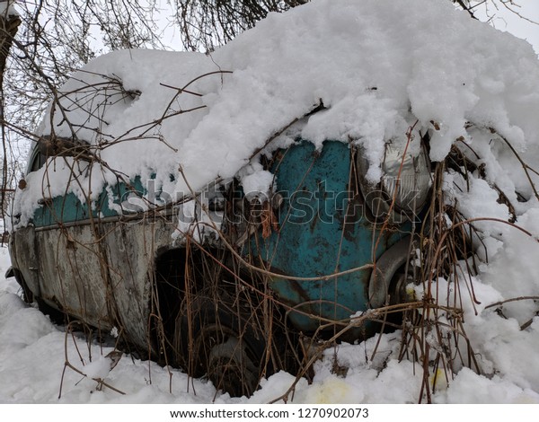 vintage car, car\
under the snow, wrecked\
car